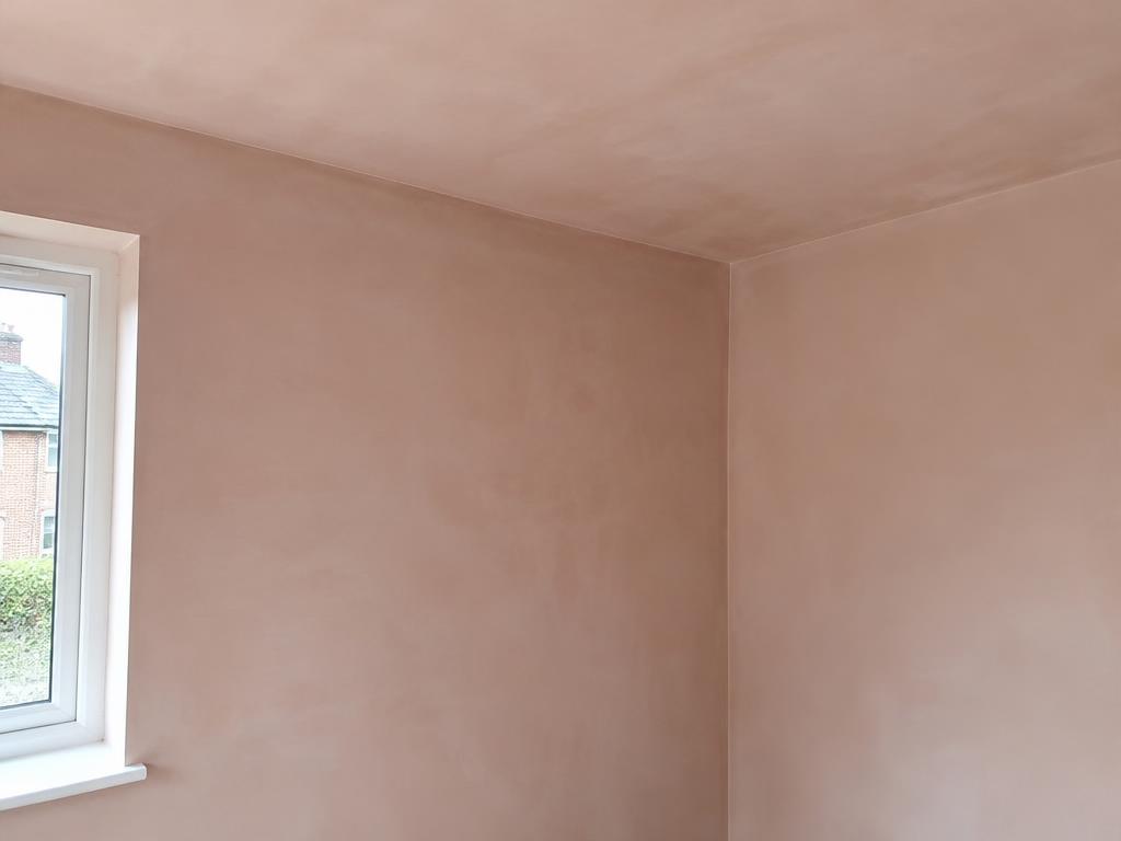 Freshly plastered wall and ceiling corner in a room